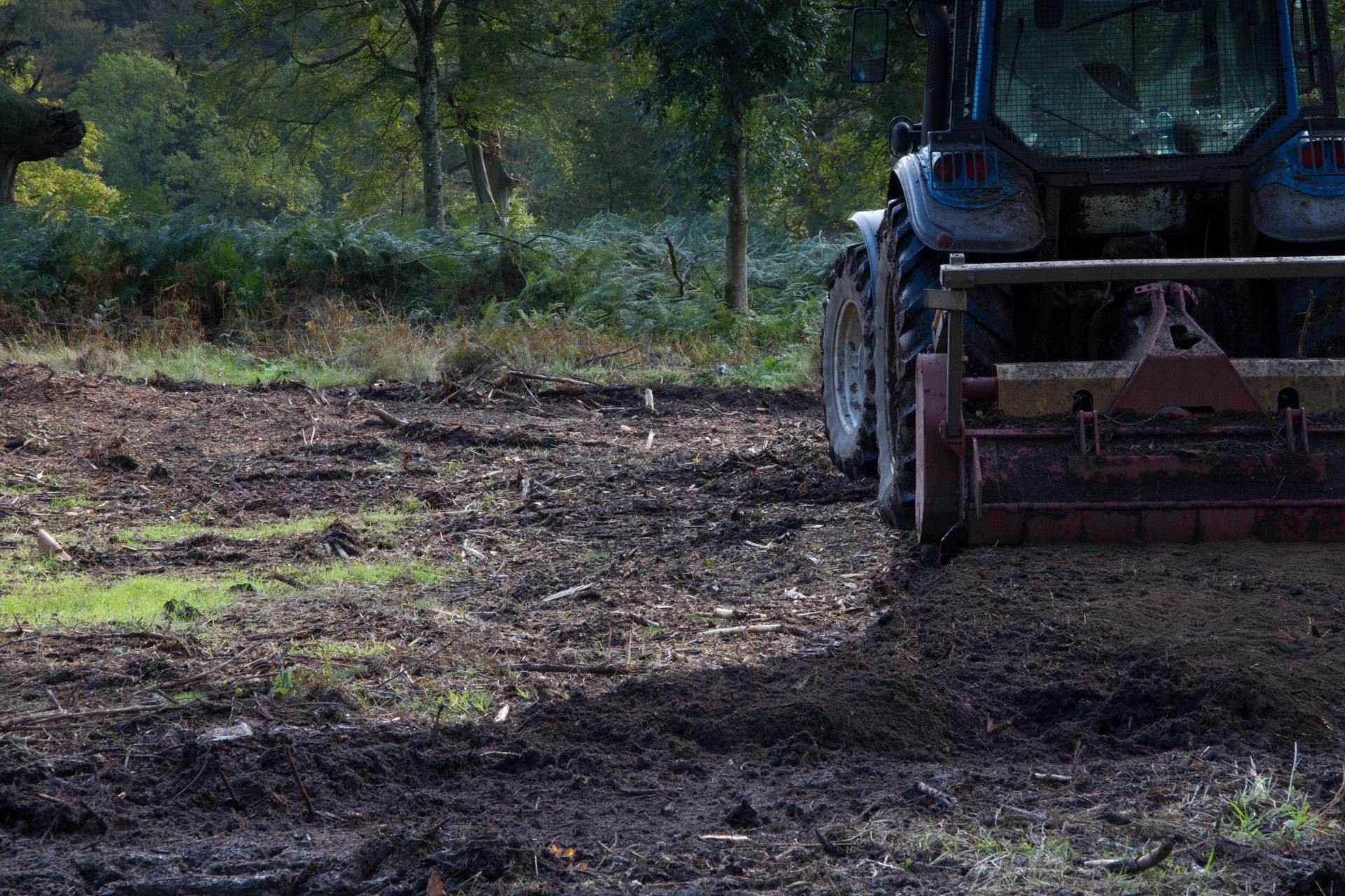 a tractor using a mulcher for site clearance